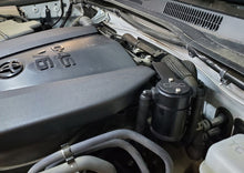 Load image into Gallery viewer, J&amp;L 16-22 Toyota Tacoma 3.5L Driver Side Oil Separator 3.0 - Black Anodized